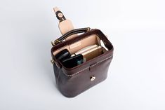 "*DOCTOR BAG'S HANDMADE VIDEO* https://youtu.be/QpdhSCjh2BM Product Description * Material: vegetable tanned leather * Color: Hand-dyeing -Chocolate * Flap over entry with magnetic buckle closure * 0.75\" wide leather shoulder strap adjust from 36.61\" to 44.88\" * Sewn by hand; * Size: 170mm (H) x 180mm (W) x 110mm (D) / 6.7\" x 7.0\" x 4.3\" The Installation of Doctor Bag Frame #Please see the last picture# Doctor Bag Frame is connected by two pairs of screws. Although we will tighten the scre Leather Doctor Bag, Leather Handheld Phone Bag For Everyday Use, Everyday Leather Handheld Phone Bag, Everyday Handheld Leather Phone Bag, Leather Bucket Box Bag As A Gift, Daily Use Bucket Bag Satchel With Cell Phone Pocket, Handheld Leather Satchel With Cell Phone Pocket, Leather Satchel Phone Bag For Office, Leather Mobile Phone Box Bag For Travel