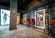 a room filled with lots of different types of sports gear and posters on the wall