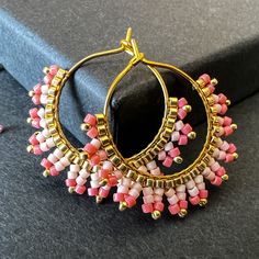 You can choose between Gold or Silver plated hoops. The hoop size is 20mm Earring Length: 3.2 Centimeters; Width: 3 Centimeters Color: Gold or silver miyuki DB and toho sb with watermelon, salmon peach DB These earrings epitomize craftsmanship, utilizing top-tier branded beads such as Miyuki Delica beads and TOHO seed beads. Meticulously handcrafted with a robust beading thread, these earrings guarantee enduring shape retention and bead stability, even with continuous wear. A diverse spectrum of color combinations is available to cater to individual preferences, while all metallic components are expertly fashioned from high-quality brass. Hypoallergenic earring hooks prioritize wearer comfort and safety. Each design in the shop reflects a profound commitment to artistry, characterized by p Handmade Small Hoop Huggie Earrings As Gift, Handmade Small Hoop Huggie Earrings For Gift, Modern Pink Small Hoop Earrings, Modern Pink Small Hoop Jewelry, Handmade Metal Hoop Earrings With Round Beads, Pink Small Hoop Earrings In Metal, Handmade Minimalist Beaded Earrings For Gift, Small Hoop Pink Metal Earrings, Pink Small Hoop Metal Earrings