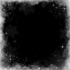 a black and white photo with snowflakes in the middle, on a dark background