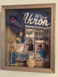 a baseball memorabilia display in a wooden frame