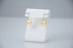 "14K solid gold earrings. 14K solid gold tiny disc earrings. Tiny gold disc earrings. Simple earrings. Dainty earrings. Gift for her. These earrings are simple and can be worn everyday. * 14K solid gold disc is 3/8\", 22 gauge. Please select yellow gold or white gold. * 14K solid gold ear wire The earrings will be shipped in a nice gift box. To see add-on click on the link below. https://www.etsy.com/shop/SashJewelry?section_id=12359884 To see more children's jewelry click on the link below. htt Tarnish Resistant Round Disc Earrings As Gift, Gold Sterling Silver Round Disc Earrings, Gold 14k Round Disc Earrings, Elegant Tarnish-resistant Round Disc Earrings, Simple 14k Gold-filled Round Earrings, Yellow Gold Round Disc Earrings For Everyday, Simple 14k Gold Filled Round Earrings, Simple 14k Gold Filled Earrings, Nickel-free Yellow Gold Round Disc Earrings