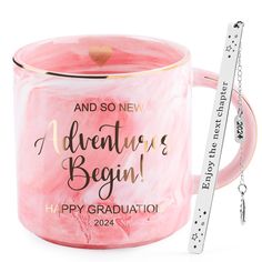 a pink mug with the words, and so new adventures begin happy graduation on it