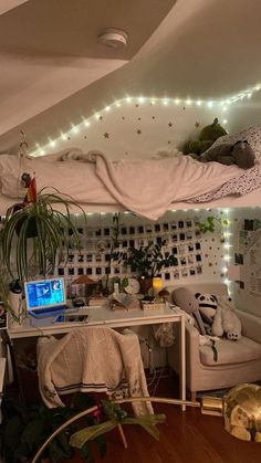 a bed room with a laptop computer on top of it