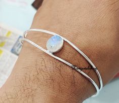 Moonstone Bangle, 925 sterling silver Bangle ,charm link Bangle, silver jewelry, gift for her, Fashion Bangle,Beatiful Bangle Bangles help in maintaining and recharging our energy levels as well. The electricity passing out through the skin is again reverted to our own body because of the ring-shaped bangles. Since bangles are circular in shape there are no ends to pass the energy outside ,and thus the energy is reverted back to the body SStyle:- Bangle Gemstone :- Moonstone Colour:- White (Newj Silver Bracelets With Simple Design For Gift, Silver Bracelets For Gifts, Silver Bracelets Simple Design Gift, Minimalist Oval Bangle As A Gift, Minimalist Oval Bangle As Gift, Minimalist Oval Bangle Gift, Sterling Silver Bracelet With Simple Design For Gifts, Silver Sterling Bracelet Simple Design Gift, Sterling Silver Bracelet Simple Design Gift