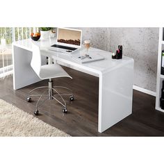 a white desk with a laptop on it in front of a bookcase and wine bottles