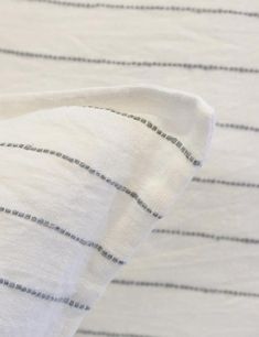 a close up view of a white and black striped fabric