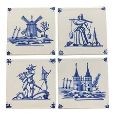 four blue and white tiles with an image of a man holding a windmill on them