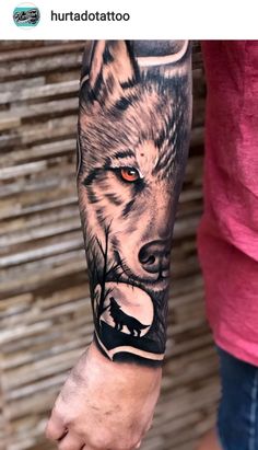 a man with a wolf tattoo on his arm