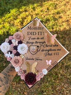 a graduation cap with flowers and butterflies on it that says, mommy did it i can do all things through christ who strength me