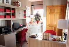 a home office area with desk, computer and bookshelf