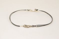 crescent moon and star bracelet for men - cord bracelet with a silver tone moon and star charm. The color of the cords is gray and made of waxed cotton. The charm is zinc alloy metal. You can request a different cord color from the colors shown in the last picture. The bracelet is 7 1/2 inch long. If you would like a different length, please choose your option at checkout. This bracelet is great as a gift for a man or a boy. All of our jewelry comes wrapped and ready for gift giving! *if you wou Everyday Silver Braided Bracelet With Sliding Knot, Silver Jewelry With Sliding Knot For Everyday, Silver Minimalist Jewelry With Adjustable Clasp, Minimalist Silver Braided Bracelet For Friendship, Everyday Silver Jewelry With Sliding Knot, Silver Sliding Knot Bracelet For Everyday, Minimalist Silver Bracelet With Adjustable Clasp, Minimalist Silver Jewelry With Adjustable Clasp, Minimalist Silver Bracelets With Sliding Knot