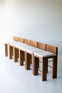 three benches are lined up against the wall