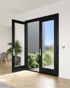 an open door leading to a dining room with potted plant in the corner and glass sliding doors on both sides