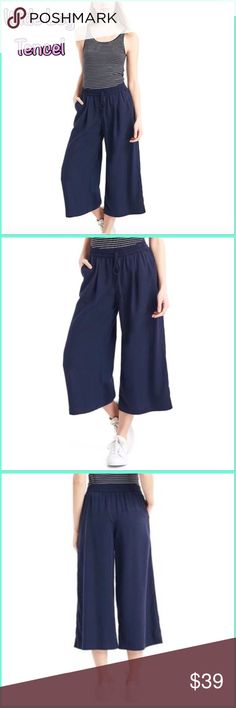 ❣️Gap Women's Navy Tencel Drapey Culottes pants Gap Dark Night Tencel Wide Leg Crop  Size Small, Brand new with out tags Sits at the upper waist. Relaxed through the hip and thigh. Wide leg opening hits at mid-calf. Inseam: regular 21" This product is made with TENCEL™ (Lyocell), a more sustainable fiber made from wood pulp sourced from responsibly managed forests. Shirring and drawcard ties at elasticized waist. Front slant pockets. Inner label is marked  ❣️ Top seller, 24hr shipping. Posh amba Wide Leg Summer Capris For Loungewear, Wide Leg Capris With Pockets For Loungewear, Gap Casual Trousers, Casual Loungewear Capris With Cropped Leg, Casual Wide Leg Sleepwear For Spring, Casual Sleep Pants, Casual Gap Trousers, Casual Wide Leg Culottes For Loungewear, Summer Loungewear Pants By Gap