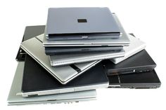 a pile of laptops sitting on top of each other