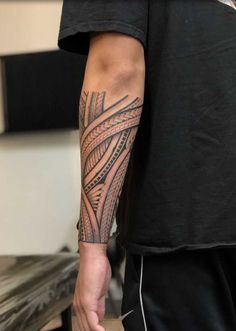 a man with a tattoo on his arm