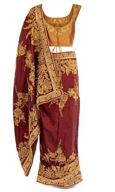 • Saree is pre-stitched• Saree is pre-pleated• Matching underskirt is included• Blouse has a drawstring back for adjustability• Blouse has padded inserts They’ll worship you in this get-up. The burnt orange blouse embellished with gold is complemented by a maroon silk Saree. Beautifully embroidered with gold thread and beadwork, be the Queen that you are. Maroon Silk Saree, Mens Indian Wear, Stitched Saree, Western Wear Dresses, Orange Blouse, Gold Thread, Cute Crop Tops, Gold Threads, Boho Women