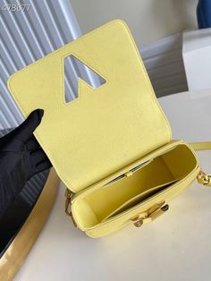 Description L.V Twist PM Ginger Yellow For Women, Women’s Handbags, Shoulder And Crossbody Bags 7.1in/18cm LV M58571 Rep 1:1 The Twist PM handbag looks adorable with a playful scrunchie around its top handle. The bag made from colored Taurillon with the scrunchie in matching smooth. The signature LV Twist lock is in the same color as the rest of the bag. A detachable strap allows shoulder and cross-body carry. 18 x 5.1 x 3.1 inches / 18 x 13 x 8 cm (Length x height x width) Ginger Yellow Microfi Lv Twist, Louis Vuitton Shirt, Yellow Handbag, Louis Vuitton Twist, Evening Clutch Bag, Tote Backpack, Louis Vuitton Handbags, Belts For Women, Fashion Handbags