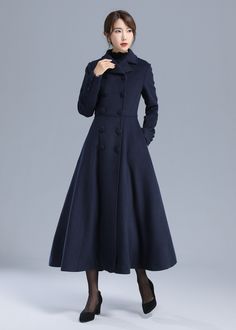 "\" It is strikingly elegant, and it carries itself with a brilliance of beauty and grandeur. It has a great classic silhouette.\" Details: * More color optional https://etsy.me/3AwTfvZ * Wool composition \" 50% wool blend + fiber + nylon\" ; Thick weight and warm wool * Absolutely fantastic coat! Very well-made and fully lined (matching satiny material). * It is classic and the color is so vibrant, color is shown in the picture-navy blue * double breasted fastening * two pockets * long sleeves Elegant Blue Double-breasted Peacoat, Elegant A-line Outerwear With Button Closure, Elegant A-line Outerwear With Buttons, Elegant Fitted A-line Wool Coat, Elegant A-line Wool Coat, Long Wool Evening Coat For Winter, Elegant Single-breasted A-line Outerwear, Elegant Long Wool Coat With Buttons, Elegant Long Solid Wool Coat