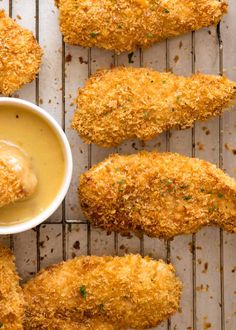 fried chicken tenders with dipping sauce on the side