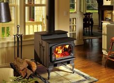 a wood burning stove sitting inside of a living room