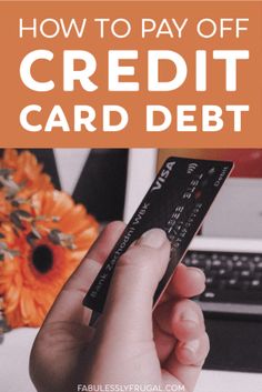 a person holding up a credit card in front of a laptop with the words how to pay off credit card debt