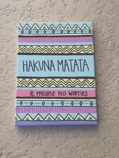 a sign on the wall that says hakuna matata it means no words