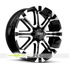 a black and white wheel with the words tuff on it's center piece