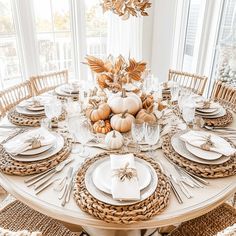 a dining room table set for thanksgiving dinner