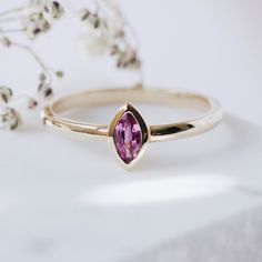 This is unique sapphire engagement ring with a purple sapphire marquise cut. This ring is a beautiful engagement ring for wedding proposal. 100% handcrafted with love! D E T A I L S ● Metal: 14K solid gold ● Gemstone: Sapphire, Natural Gemstone ● Gemstone weight: Sapphire 0.33ct ● Gemstone shape: marquise cut R I N G ∙ S I Z I N G For General Reference: ● we use standard US Ring Sizing ● an average women's ring finger is size 6-7 ● each ring is custom made upon order, in any desired size. ● if y Sapphire Engagement Ring Marquise, Purple Sapphire Engagement Ring, Purple Engagement Rings, Unique Engagement Rings Sapphire, Engagement Ring Marquise Cut, Custom Gold Rings, Ring For Wedding, Engagement Ring Marquise, Marquise Cut Engagement Ring