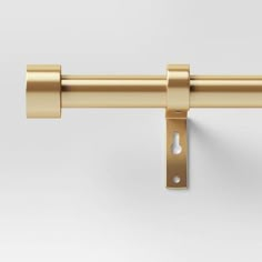 an image of a gold curtain rod