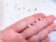 Tiny stars stud earrings 925 Sterling Silver | Rose gold small stars ear studs | Valentine's Day gift | Dainty stars small earrings. Perfect earrings to wear everyday or for your second ear piercings. Those earrings are perfect for sensitive ears, are 925 Sterling Silver, hypoallergenic and nickel free. 925 stamped. Metal : 925 Sterling Silver ( Rose gold plated ). Weight : 0,35g. Measurements : 4mm x 4mm. All our items are ship in a organza bag inside of a waterproof bubble envelope. Free and r Minimalist Star-shaped Hypoallergenic Cartilage Earrings, Minimalist Hypoallergenic Star Cartilage Earrings, Minimalist Hypoallergenic Star Piercings, Minimalist Star-shaped Cartilage Earrings With Star Charm, Hypoallergenic Star-shaped Cartilage Earrings For Everyday, Hypoallergenic Star Piercings As Gift, Nickel-free Star-shaped Cartilage Earrings As Gift, Nickel-free Star-shaped Cartilage Earrings For Gifts, Nickel-free Star Cartilage Earrings As Gift