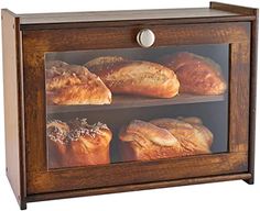 an image of breads in a glass case on the side of a cabinet for display