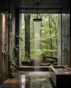 a large bathroom with a waterfall in the shower and an outdoor bathtub next to it