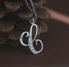 "Beautiful Initial Necklaces Solid Sterling Silver, perfect for anyone any age any occasions and everyday wear Great gift for that special someone or yourself. Item Specifications: Model # Letter C Metal Type: Sterling Silver Metal Stamp: 925 Shape: Letter C Finish: Rhodium Plated Style: Script Letter Size: 1 x 3/8 inch ( approx 26 x 10mm) Stone: Multi CZ Stone Chain: Sterling Silver Round Cable Chain 18\" * We only sell SOLID metals Stamp: 925 Sterling Silver. We do NOT Silver plate our Jewelry Silver Hallmark Initial Pendant Jewelry, Silver Necklace With Hallmark For Everyday, Everyday Silver Necklace With Hallmark, Personalized Silver Jewelry With Diamond Accents, Silver Diamond Necklace For Birthday Gift, Sterling Silver Initial Necklace, Initial Necklace Silver, Talisman Pendant, Sterling Silver Initial