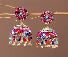 Our Indian earring is silver plated, created with careful attention to detail. The color combination and finishing give it an elegant look & feel. This design is perfect for parties & functions as these handcrafted earrings are specially designed for Indian beautiful brides -Base Metal- Alloy, Silver, Brass -Plating- Silver -Stone- Pearls, Beads & sequin -Sizing-Non Adjustable -Type- Jhumkas Earrings -Light Weight -Color- Multi -FREE Shipping -Gift Wrapping Available -Delivery from a Small Business in India -Handmade Product Skin Friendly- Lead & Nickel Free in compliance with all International Requirements. Gift - Ideal Valentine, Birthday, Anniversary gift for someone you Love/ Best Friend/Girlfriend. Occasion - Festivals, Wedding, Party Wear, Bridal, Perfect For Indian Weddings We Tried Cheap Traditional Multicolor Earrings, Cheap Handmade Festive Jhumkas, Luxury Multicolor Festive Jhumkas, Luxury Multicolor Bollywood Jhumkas, Festive Silver Beaded Earrings, Fusion Style Multicolor Jhumkas For Festivals, Silver Beaded Earrings With Latkans, Multicolor Latkans Earrings For Diwali, Multicolor Earrings As Festival Gift