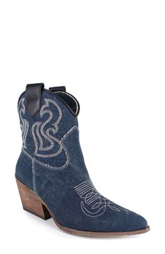 Decorative stitching and side pull-tabs lend Western-inspired elements to a trend-savvy bootie balanced by a pointy toe and block heel. 2 1/2" heel 5 1/2" shaft Leather or textile upper/leather lining and sole Made in Italy Blue Snip Toe Heeled Boots For Fall, Blue Boots With Stacked Heel For Fall, Denim Round Toe Boots For Fall, Denim Boots With Round Toe For Fall, Fall Denim Boots With Round Toe, Dark Wash Denim Boots With Round Toe, Trendy Dark Wash Boots For Fall, Western Denim Blue Boots For Fall, Denim Blue Western Boots For Fall