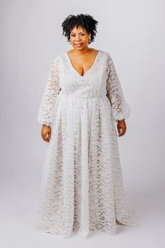 The Rue Gown is perfect for the boho bride. This gown features: V neckline and back made from soft boho-inspired lace, lined with matte satin with supportive boning Flowy, gathered skirt made from soft boho-inspired lace, lined with a matte satin a-line circle skirt Optional fitted sleeves or bishop sleeves with elastic cuffs, available as detachable or permanently attached sleeves Optional small train Center back zipper closure or optional corset back Customize this dress to make it yours by ch Lace Gown With Fitted Bodice And V-neck, V-neck Gown With Lace Bodice, Floor-length Lace Wedding Dress With Lace Bodice, Fitted Lace Maxi Dress With Lace Back, V-neck Delicate Lace Maxi Dress For Wedding, Wedding Maxi Dress With Lace Back, Lace Maxi Dress With Lace Back For Wedding, Lace Wedding Dress With Fitted Bodice And V-neck, V-neck Delicate Lace Dress For Wedding