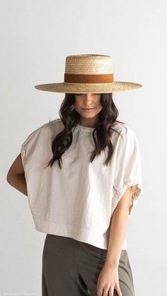 DESCRIPTION:The Capri is a classic boater style hat in natural dyed wheat straw with a stiff brim. The wide brim of the Capri Medium makes for a great sun hat to take to the beach or pool. The Capri features a camel suede band with our signature xx stitching on back. The suede band is sprayed with a weather protectant spray, but is not considered waterproof. Color: Natural Content: 100% Wheat Straw / Suede band / Cotton poly inner sweatband. 9.5 cm crown height and 11 cm brim width. Imported Please Note: Exact colors and patterns may vary slightly from the image(s) shown, due to differences in photographic lighting sources and, or monitor settings. ABOUT THE FIT: Fit: Made with an adjustable inner band to ensure the perfect fit! How to measure for fit: For hat sizing tips check out our hat Gigi Pip, Straw Boater Hat, Straw Boater, Wide Brim Straw Hat, Sailor Hat, Boho Hat, Boater Hat, Wheat Straw, Halo Style