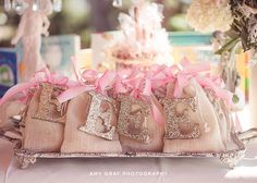 a baby shower cake with pink bows on it