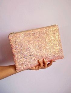 Bubblegum Pink Glitter Clutch Bag. This sparkly bubblegum pink clutch bag is made out of a glitter covered cotton and would be the perfect accessory for a spring wedding, festival and parties. This light pink has a shimmer of iridescent glitter that catches the light. This bag comes with a beige YKK zip with gold teeth and measures about 10" x 7". These would make really pretty gifts and add some sparkle to any wardrobe. They're big enough to fit your everyday essentials in such as a mini iPad, Pink Sequin Evening Bag, Glamorous Pink Evening Bag As Gift, Glamorous Pink Evening Bag For Gifts, Pink Glitter Party Bag, Pink Glitter Party Bags, Glamorous Pink Bags For Everyday Use, Glamorous Pink Bag For Everyday Use, Pink Sequined Party Bags, Party Clutch Bag With Zipper Pouch