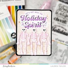 a card with the words let's get into the holiday spirit and skeleton stickers