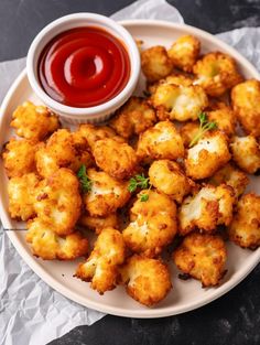 fried cauliflower on a plate with ketchup