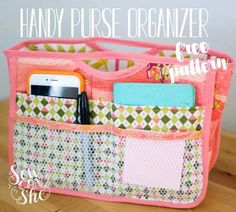 an organized purse is sitting on a table with the words handy purse organizer written above it