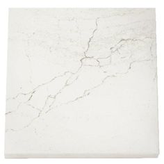 a white marble tile with cracks in it