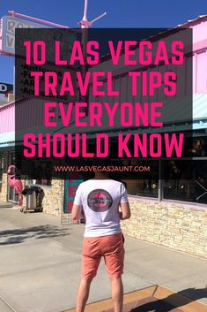 a man standing in front of a pink building with the words 10 las vegas travel tips everyone should know