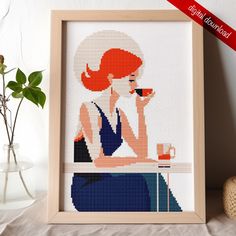 a cross - stitch picture of a woman drinking from a cup with a red hair