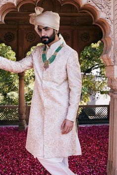 Cream sherwani with tonal thread embroidered floral motifs. Comes with inner kurta and churidar.
Components: 3
Pattern: Embroidered
Type Of Work: Thread
Neckline: Mandarin Collar
Sleeve Type: Full
Fabric: Raw Silk
Color: Cream
Other Details: 
Weight: 1.8 Kgs
Closure: Sherwani: Front closure
Note: Only selling products mentioned in the description
Occasion: Wedding,Destination Wedding - Aza Fashions Traditional Fit Sherwani With Intricate Embroidery For Festivals, Festive Sherwani With Traditional Fit And Drape, Traditional Sherwani For Festive Occasions, Traditional Fit Sherwani For Festive Occasions, Ceremonial Sherwani Straight Kurta, Ceremonial Sherwani With Traditional Fit, Traditional Fit Sherwani With Zari Work For Ceremonies, Traditional Fit Sherwani With Pallu, Traditional Fit Sherwani With Traditional Drape For Eid