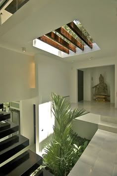 an image of a house with skylights on the ceiling and stairs to the second floor